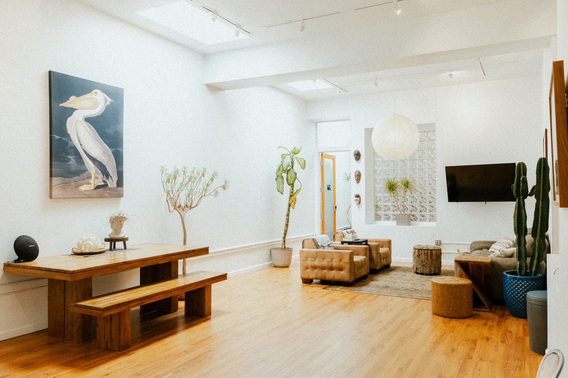 Open room with skylights and long wood table at Recovery Republic men's treatment center in Venice