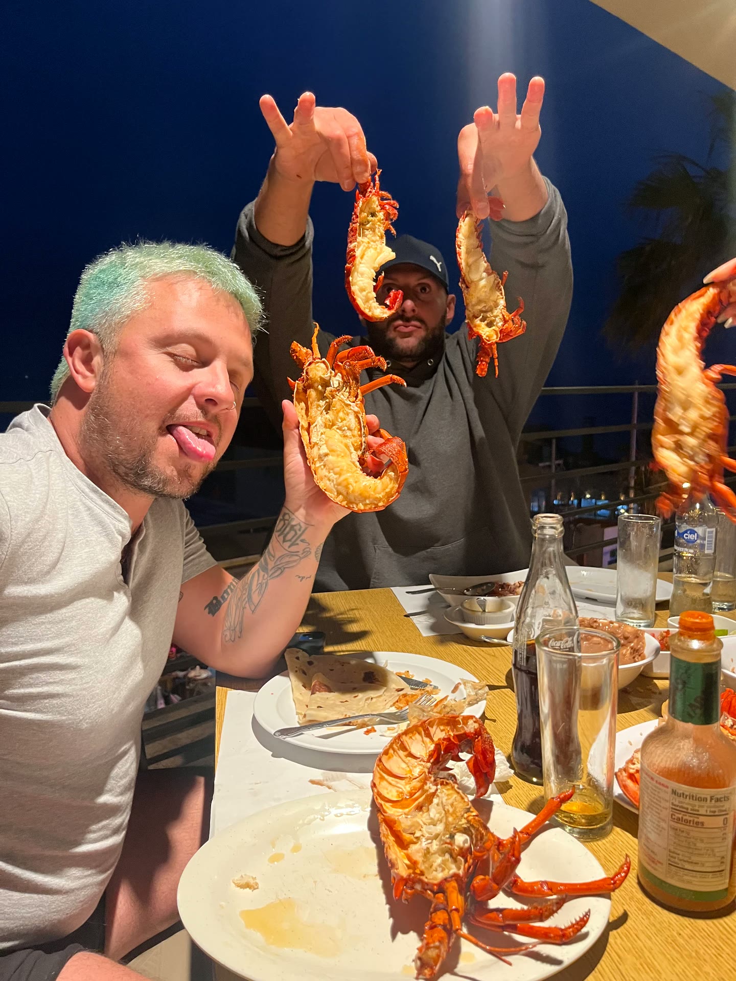 Group seafood dinner with lobster during a Recovery Republic adventure therapy trip