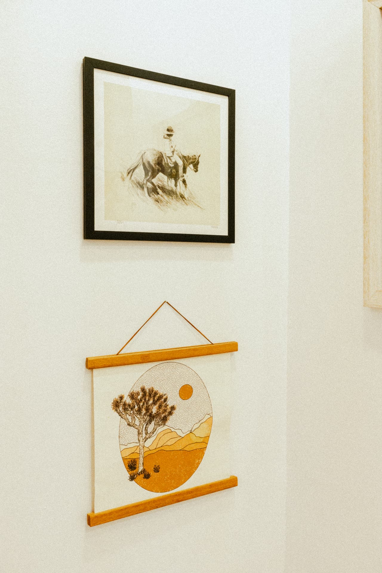 Framed desert prints on a white wall at Recovery Republic men's treatment center
