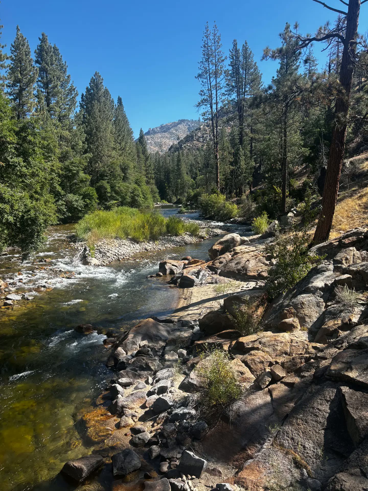 Clear river bend running through a granite canyon in Sequoia National Forest