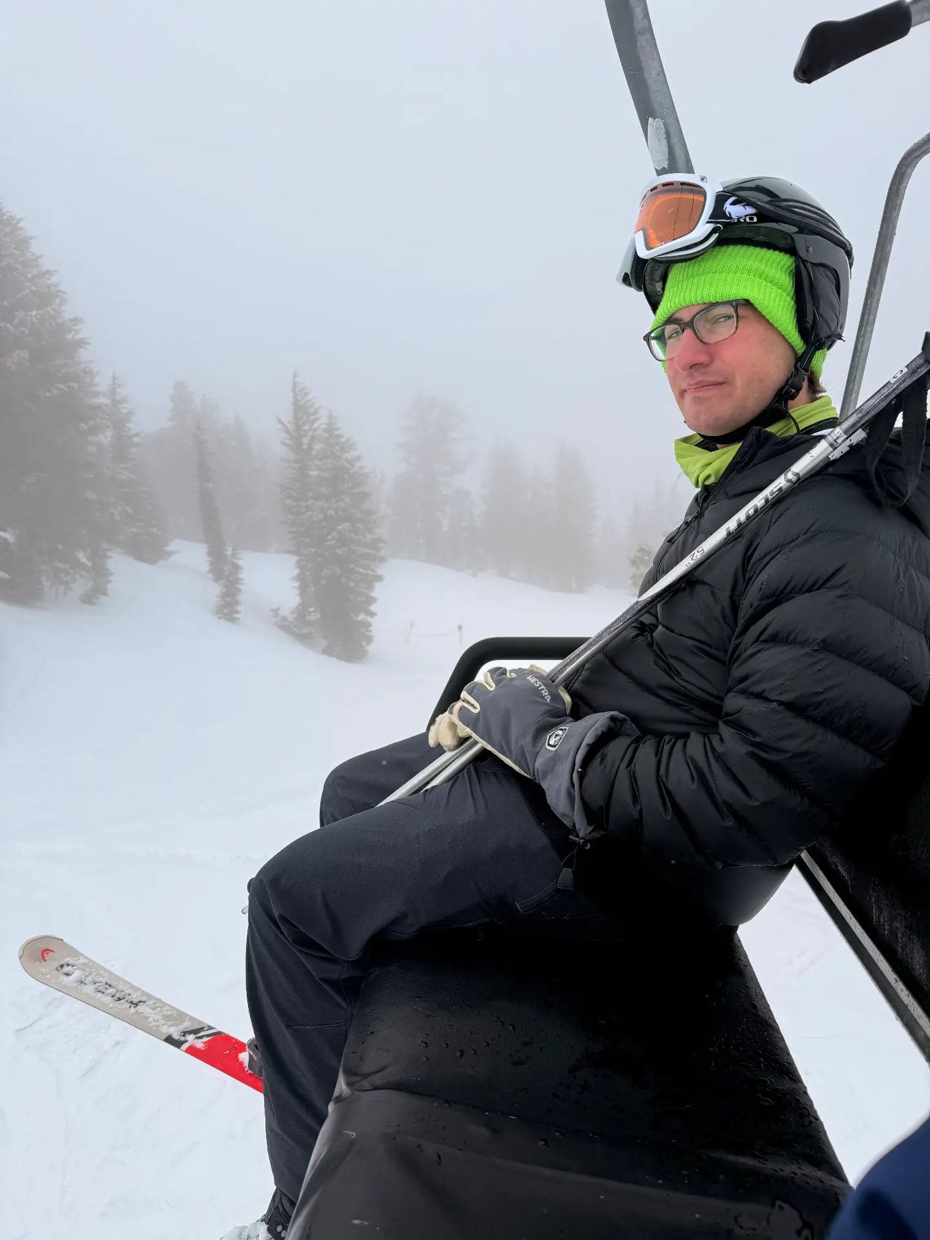 Riding the chairlift up through the fog and trees at Mammoth