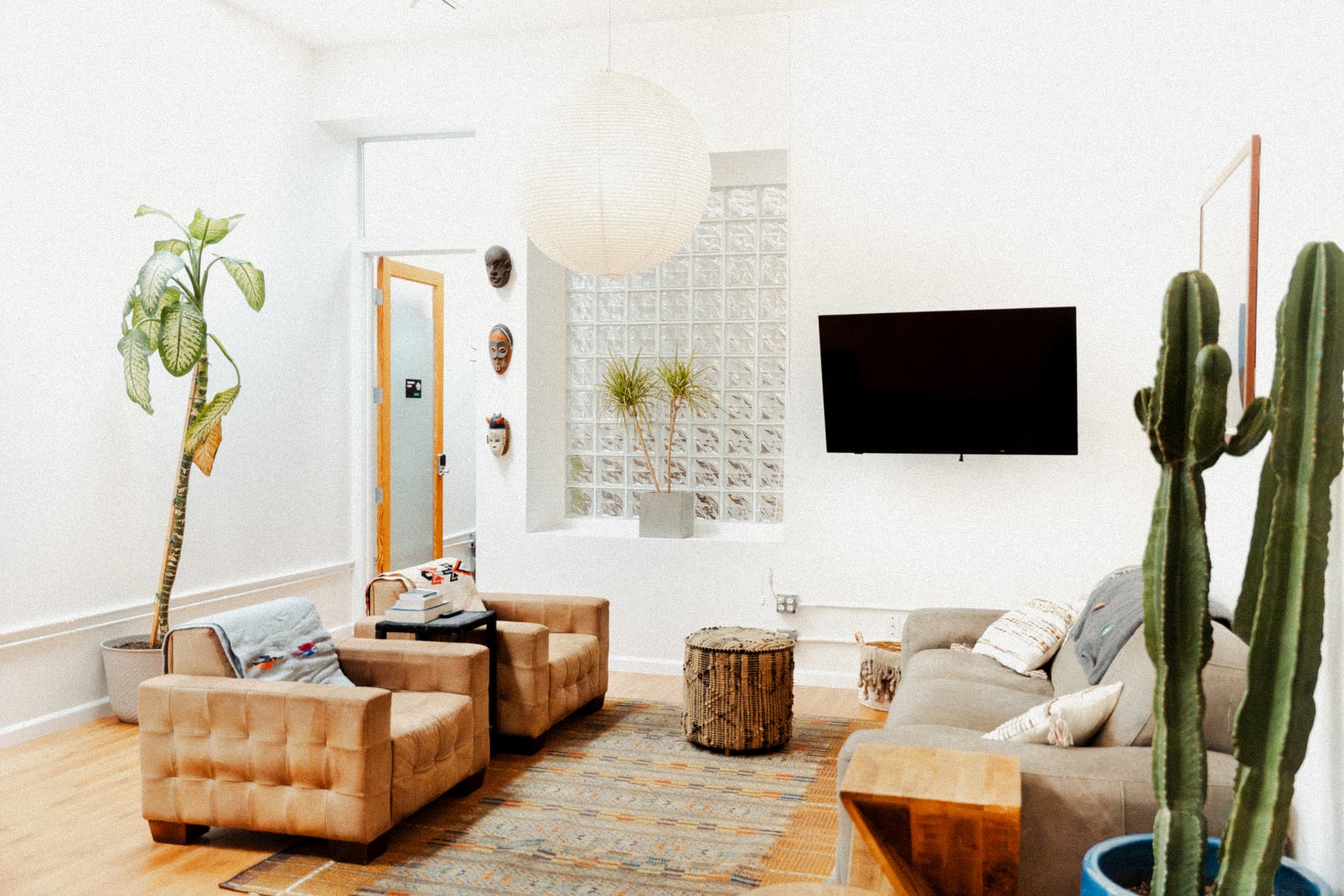 Common room with soft seating and natural light at Recovery Republic men's treatment center