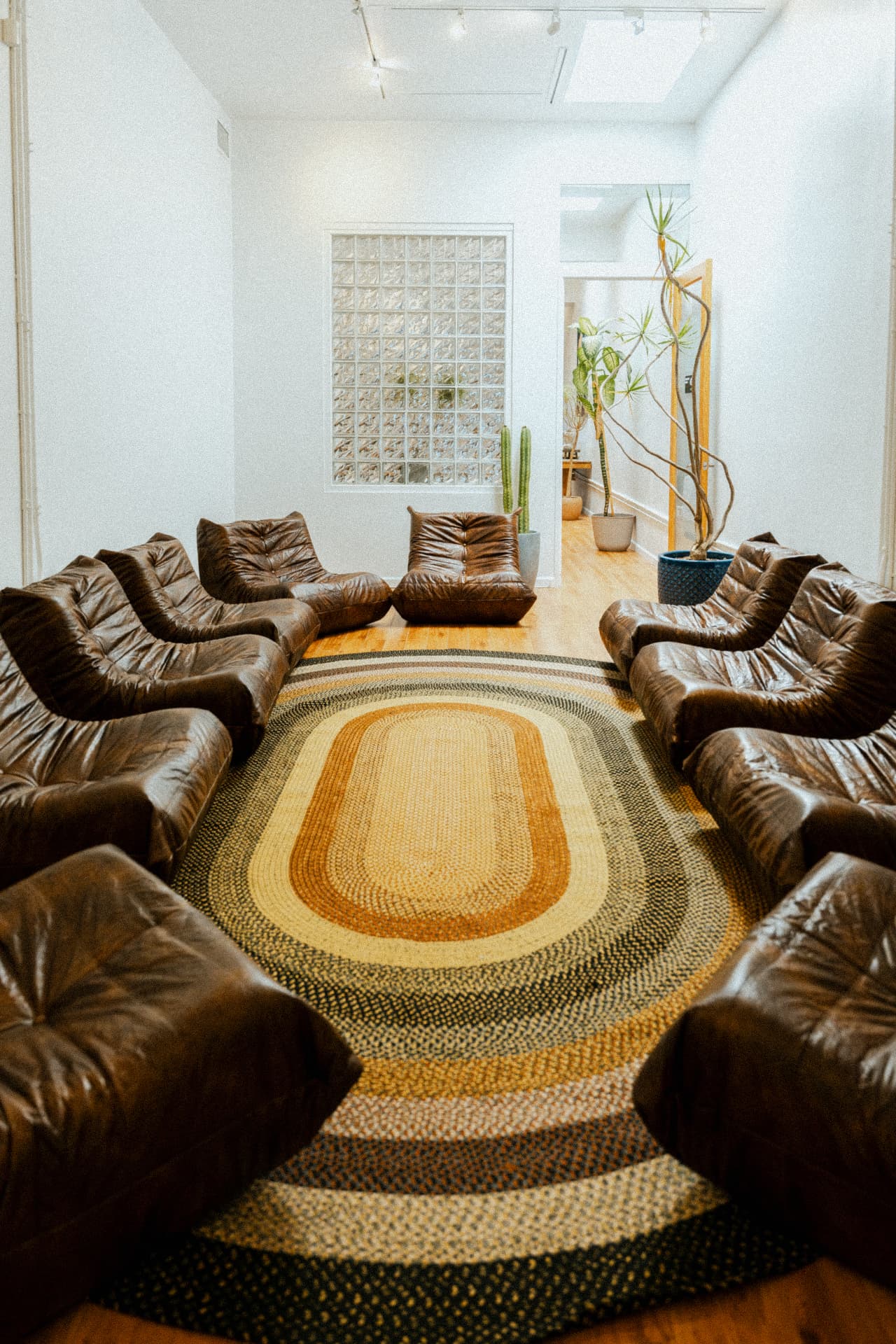 Circle of leather chairs in the men's group therapy room at Recovery Republic, Venice, California