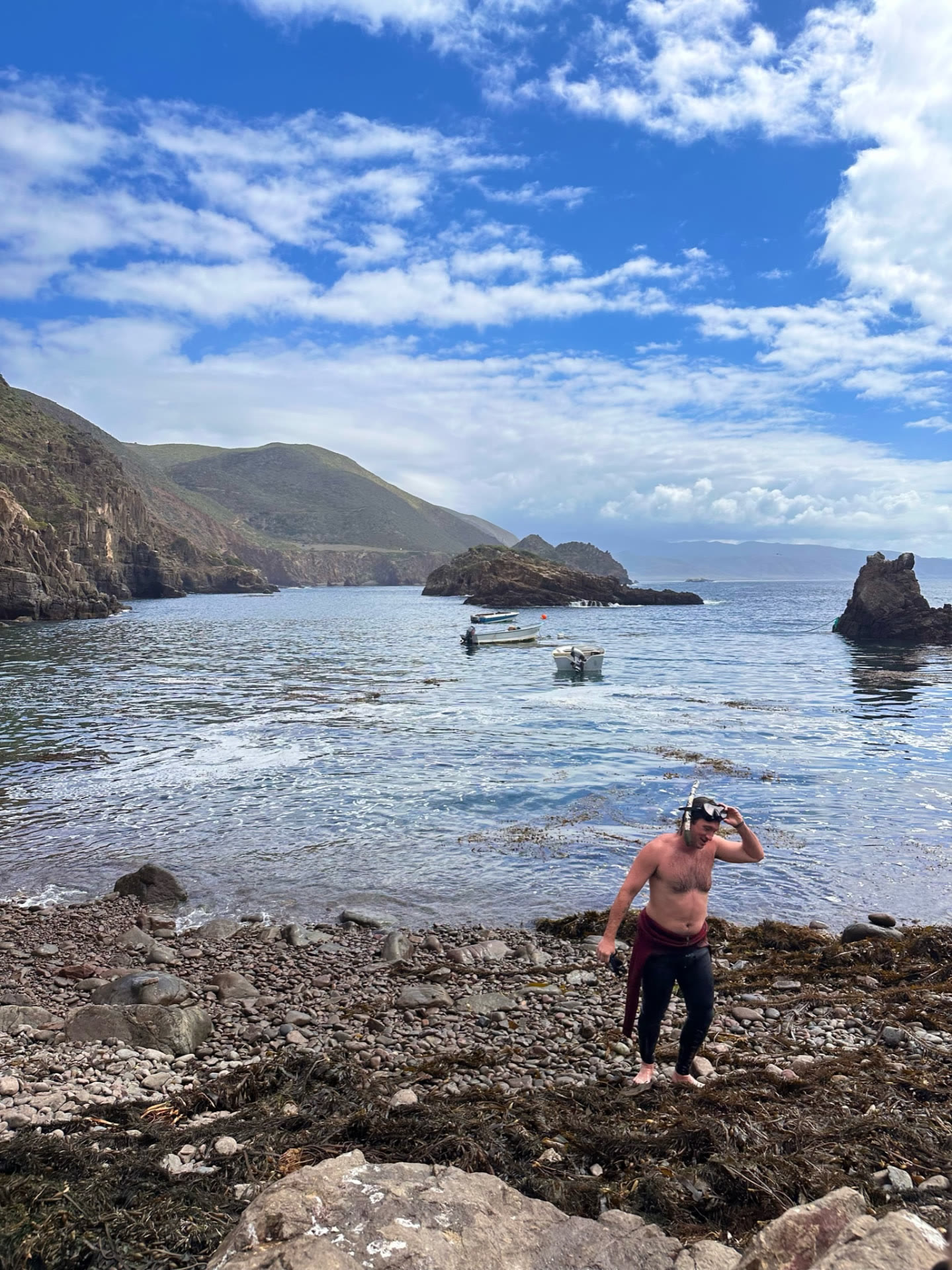 Men coming out of the water after spearfishing during a Recovery Republic adventure therapy trip in Baja