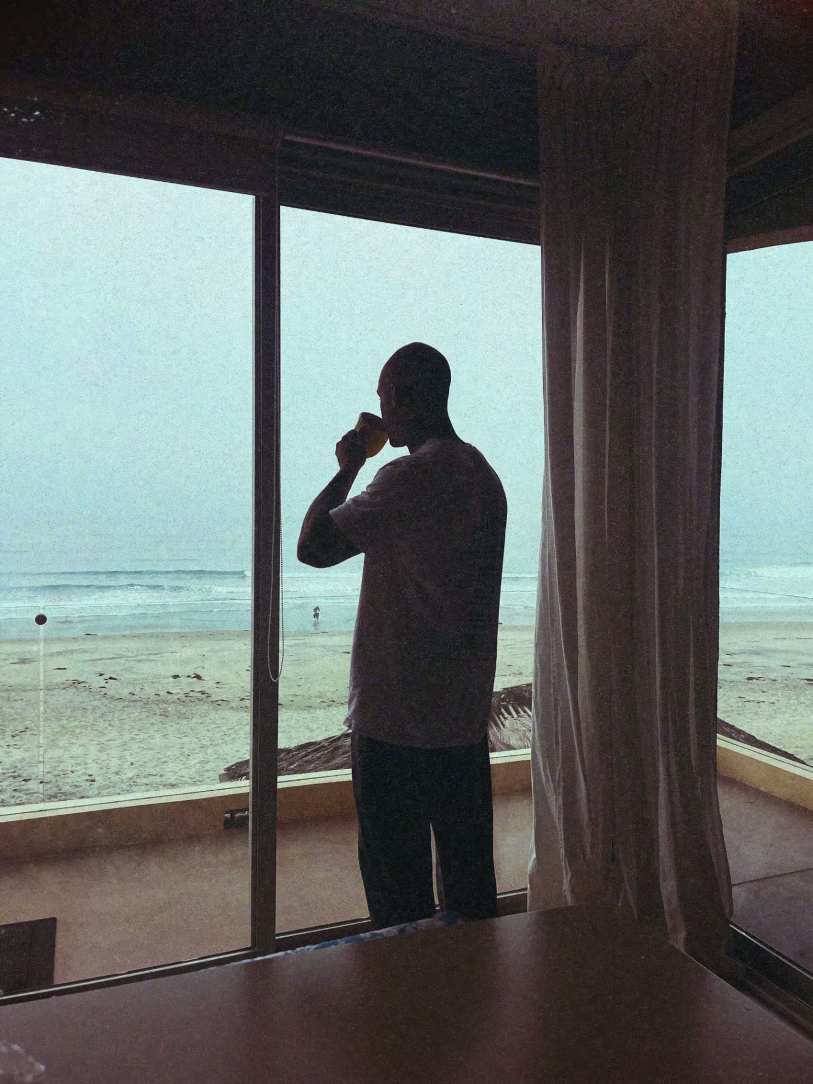 Coffee at the window watching the surf come up during a Recovery Republic adventure trip