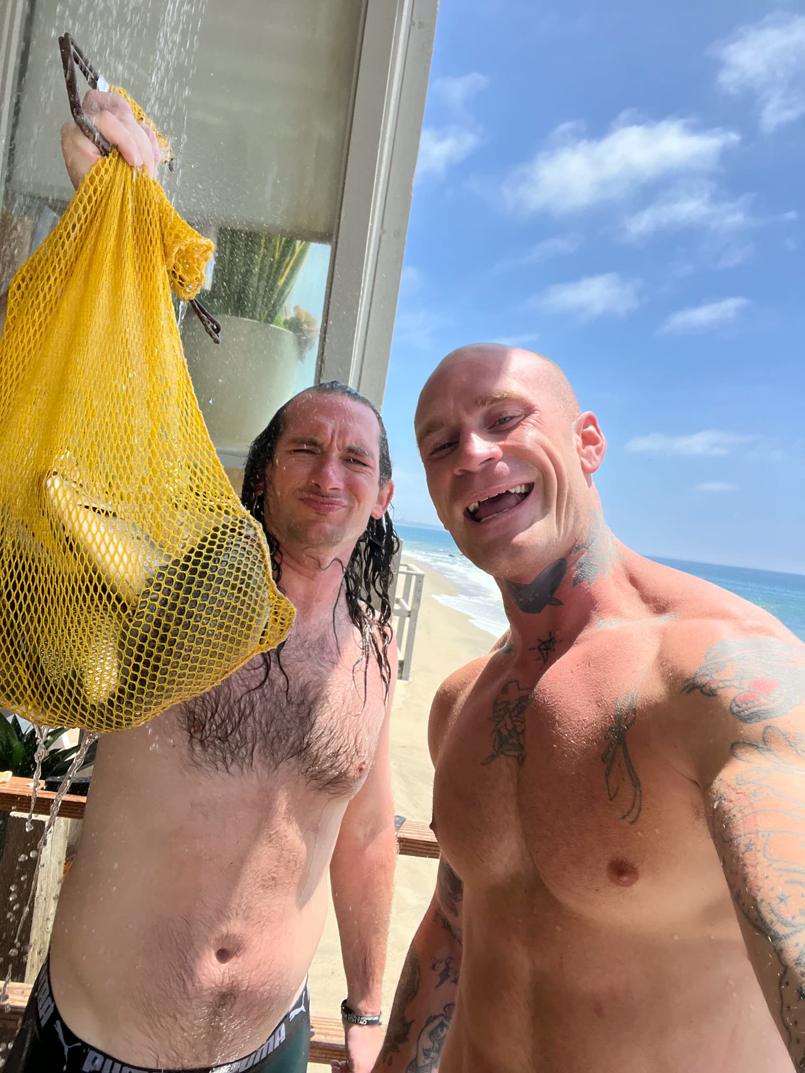 Rinsing off with the day's catch after a spearfishing dive in Baja