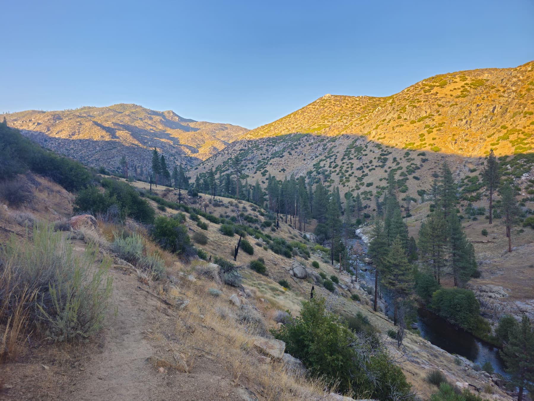 First light hitting the canyon ridges above the river in Sequoia National Forest